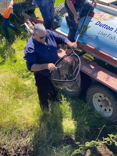 Daryl Buckingham Assisting In Trout Release